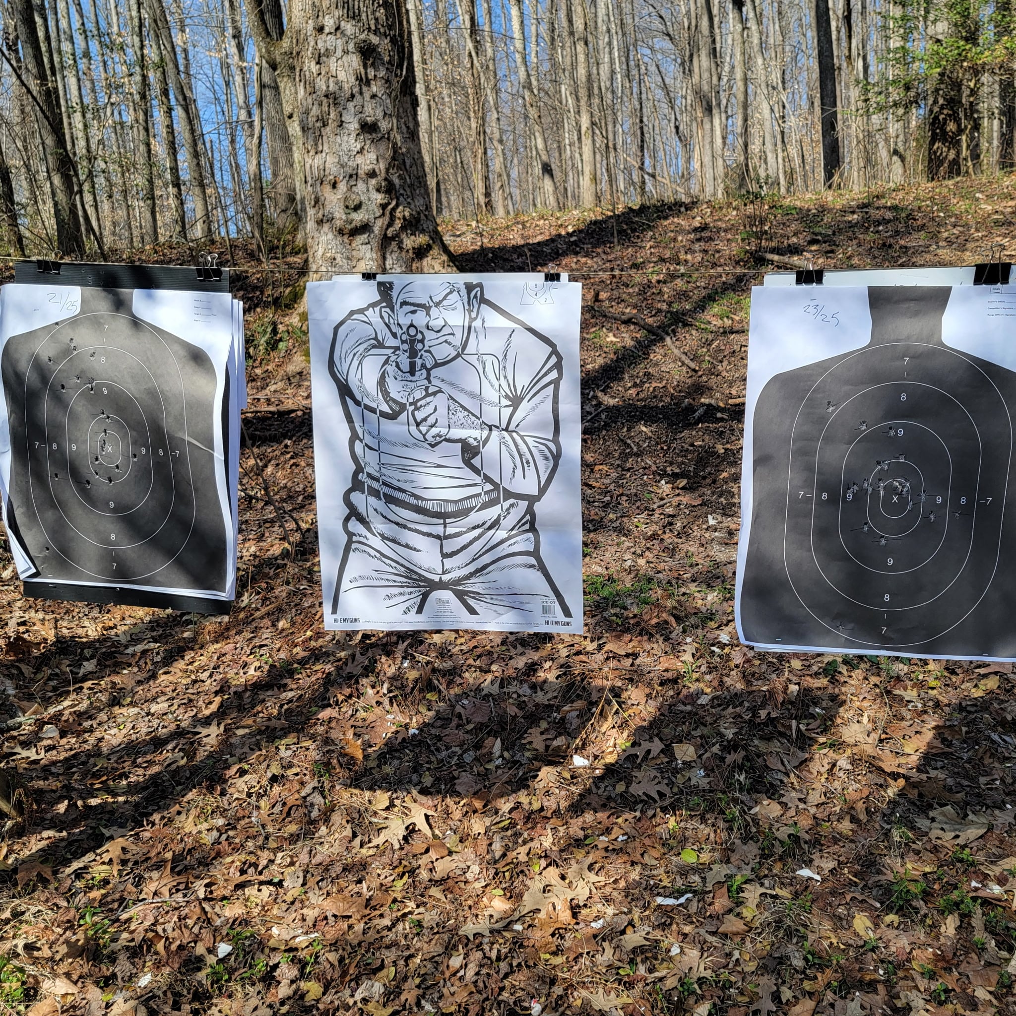 Completed paper targets showing student qualification results