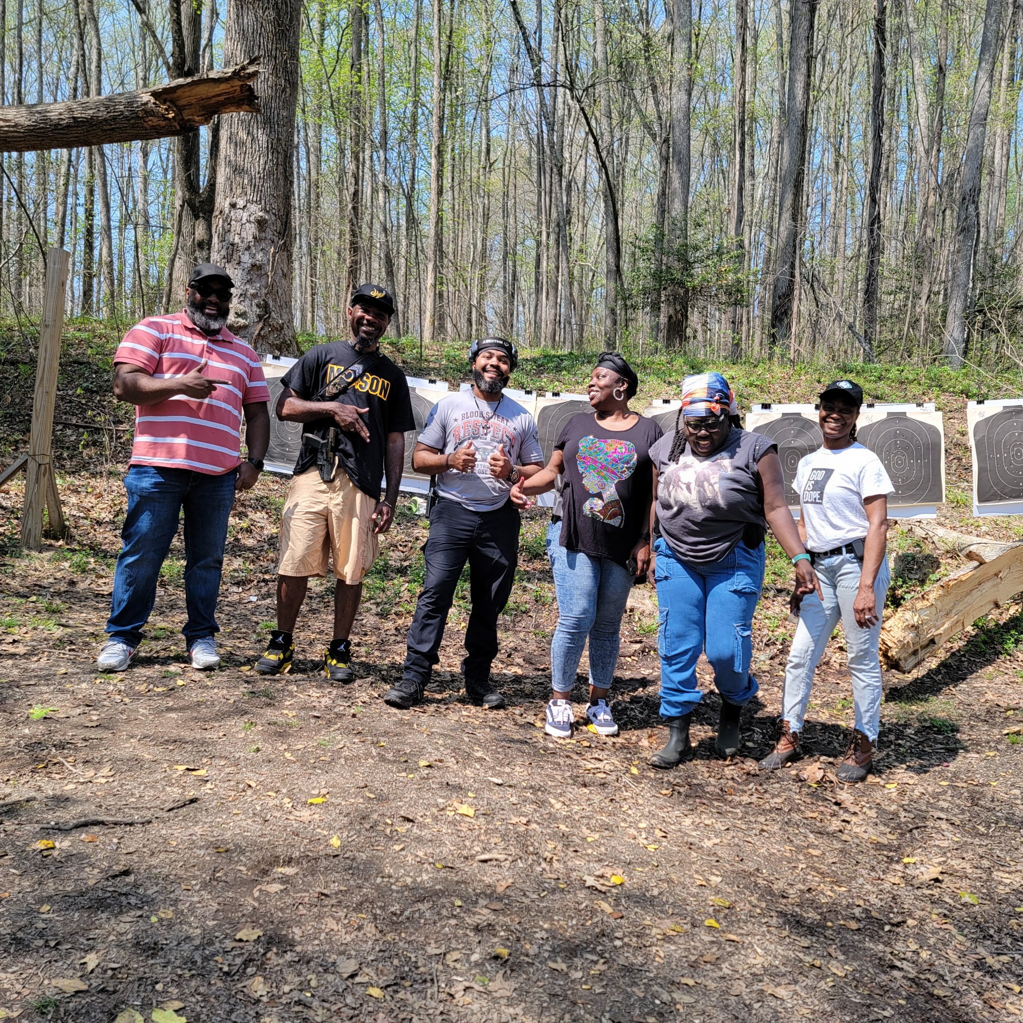 Smiling JPS Training class gathered in front of their completed targets